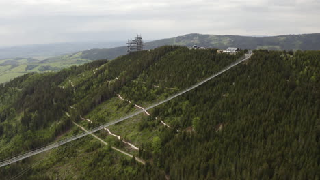 Longest-suspension-footbridge-in-world-above-valley-in-Moravia,-drone