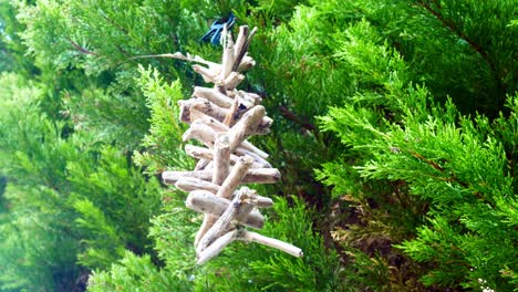 Simple-driftwood-Viking-spiritual-Valhalla-ladder-spinning-in-breeze-hanging-in-garden