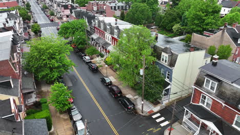 Drone-shot-of-rowhouses-lining-city-street