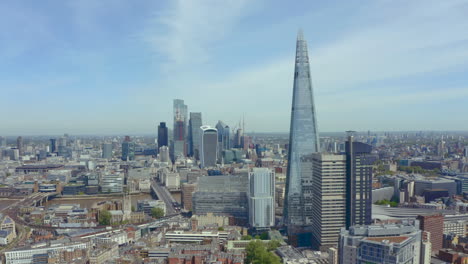 Slow-rotating-establishing-drone-shot-of-Central-London-skyscrapers-and-the-Shard