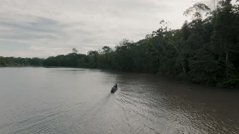 Tourist-Riding-A-Mobile-Canoe-Is-Driving-Over-A-Lagoon-In-The-Amazon-Rainforest-Of-Ecuador