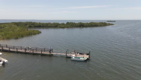 Boat-launch-to-the-ocean-in-the-middle-of-mangroves-in-Florida,-aerial-view
