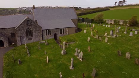 Aerial-swoop-across-Crantock-churchyard-Cemetery-graveyard