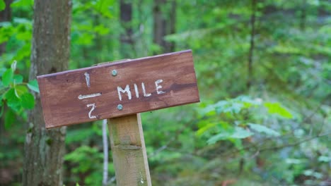 Path-half-mile-marker-sign-in-woods