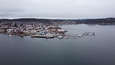 Approaching-Unger-vetlesen-and-RC-Lillesand-and-rescue-Askeladden-SAR-vessels-from-Redningsselskapet-Norway---Aerial-view-from-a-distance-while-slowly-approaching-during-early-morning