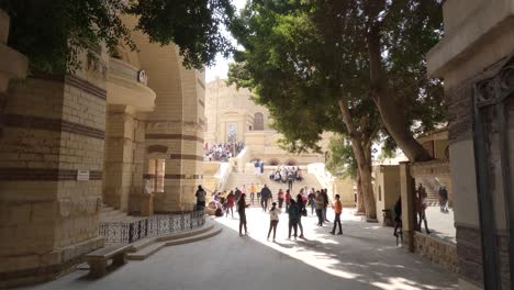View-of-the-inside-of-Coptic-Cairo-of-Egypt-showing-lots-of-visitors-moving-around-and-clicking-pictures