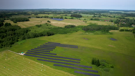Solar-panel-farms-on-agricultural-fields-in-countryside-on-summer-days