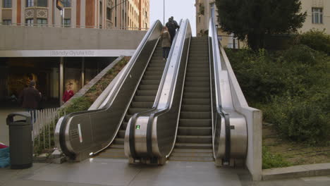 People-travel-by-escalator-from-Szell-Kalman-Square-to-Várfok-street