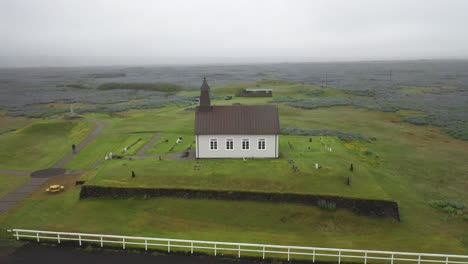 Strandarkirkja-church-in-Iceland-with-drone-video-circling-moving-up