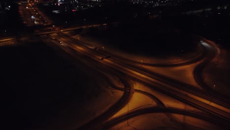 Night-aerial-flight-tracks-sparse-winter-traffic-on-divided-highway