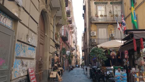 Hand-held-Footage-Of-A-Quiet-Street-Market-Stalls-In-Napoli