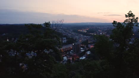 Reverse-Reveal-Shot-of-a-Beautiful-Small-Town-in-Europe-at-Sundown