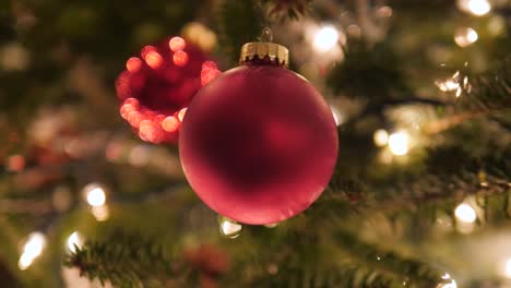 red-decoration-ball-ornament-on-Christmas-tree-in-4k