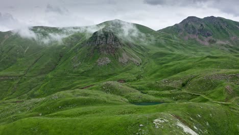 Dense-Overcast-Over-Mountains-And-Green-Hills