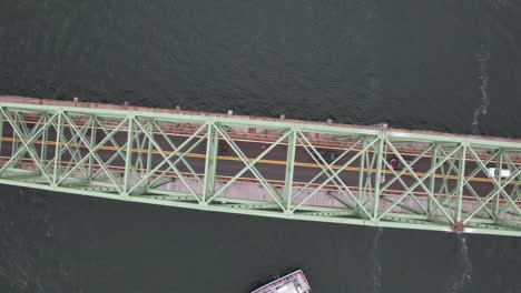 An-aerial-view-of-the-Fire-Island-Inlet-Bridge-during-a-cloudy-morning-over-calm-waters