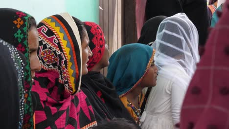 Row-Of-Women-Waiting-To-Be-Seen-At-Flood-Relief-Camp-In-Sindh