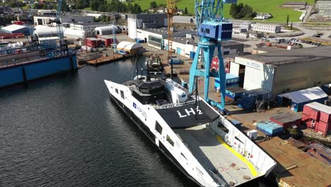 Worlds-first-hydrogen-powered-ferry-Hydra-at-Westcon-yards-for-Hydrogen-equipment-installation---White-liquid-hydrogen-tank-installed-beside-wheelhouse---Aerial-Olensvag-Norway