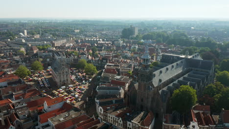 Aerial-View-Of-Famous-Cheese-Market-Outside-The-Old-Town-Hall-Of-Gouda-In-Netherlands