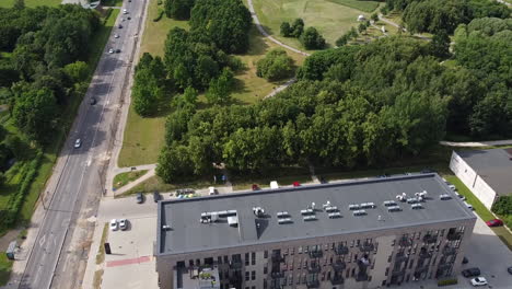 Aerial-View,-Apartment-Building-and-Green-Park-in-Suburbia-of-Kaunas,-Lithuania