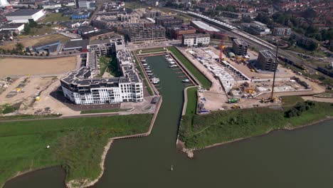 Aerial-overview-of-Noorderhaven-neighbourhood-luxury-apartment-construction-projects-at-riverbank-of-river-IJssel