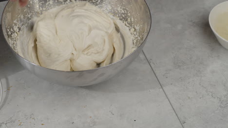 Overhead-view-of-chef-mixing-whipped-cream-with-spoon