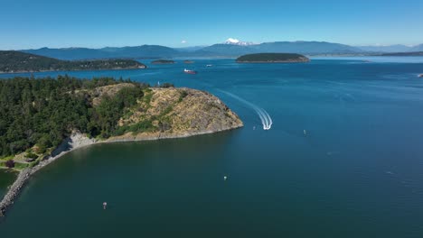 Aerial-view-of-a-motorboat-quickly-coming-into-the-Anacortes-harbor