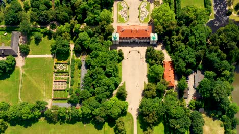 Beautiful-avenue-of-trees-of-Nieborow-Palace,-a-Baroque-style-residence-in-Poland