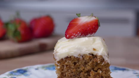 Delicious-carrot-cake-topped-with-a-strawberry-slice---close-up