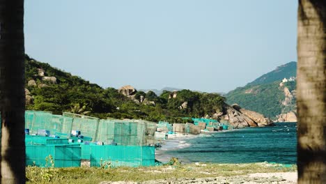 Wide-shot-showing-of-lobster-and-shrimp-farm-with-on-the-sandy-beach-of-Vietnam-during-sunny-day