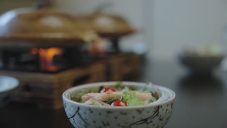 Japanese-healthy-seafood-salad-with-Nabe-pots-in-blurred-background