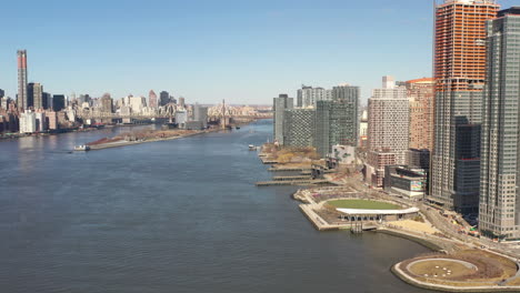 A-high-angle-view-looking-north-over-the-East-River-on-a-sunny-day