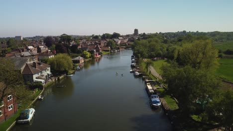 Aerial-Drone-Footage-of-along-the-River-Waveney-Over-Two-Rowers-near-Beccles,-Norfolk