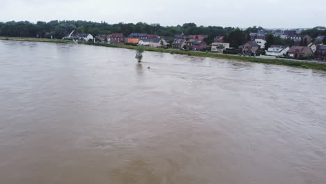 Aerial-flying-forward-over-flooding-of-Meuse-river-in-Smeermaas,-Belgium