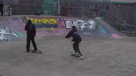 Slow-mo-of-skate-boarders-at-a-skate-park-in-Sheffield,-England