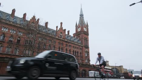 Low-angle-shot-of-traffic-in-front-of-iconic-Kings-cross-st-pancras-international-station