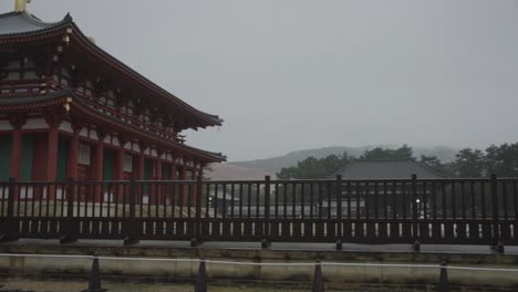 Kofukuji-Temple-in-Nara,-Pan-over-Sacred-Grounds-on-Rainy-Day-in-Japan