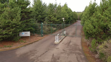Closed-Entrance-Gate-To-AT-and-T-On-Asphalt-Industrial-Road-In-Bandon,-Oregon