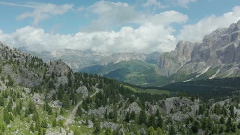 Fly-above-panorama-landscape-in-dolomites-mountain-range,-tyrol,-Italy