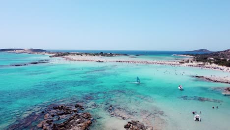 Cinematic-aerial-over-tropical-waters-of-Elafonissi-beach,-Crete,-Greece