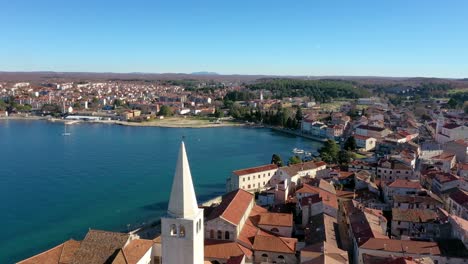 Euphrasian-Basilica-Tower-With-Porec-Town-And-Seascape-At-Daylight-In-Croatia