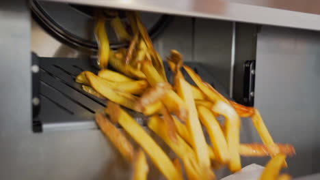 French-fries-falling-out-of-the-fryer-in-slow-motion