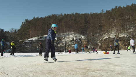 on-a-sunny-winter-day,-Kokorin,-Czech-Republic---Ground-level-wide-slide-slow-motion-shot