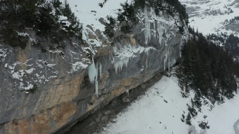 Jib-down-of-melting-icicle-on-the-edge-of-mountain
