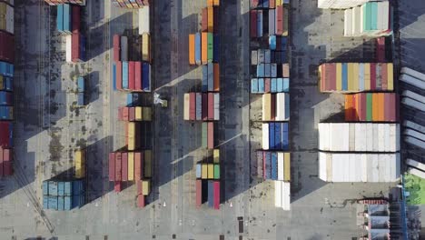 Aerial-view-of-cargo-containers-at-the-Vigo-city-Port-waiting-for-shipment-at-global-pandemic-lock-down