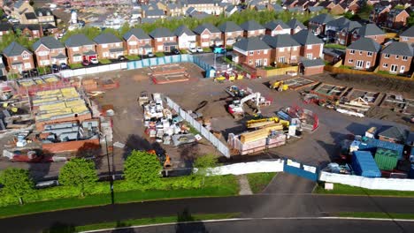 Construction-site-aerial-view-above-new-urban-real-estate-housing-development-regeneration-pan-right