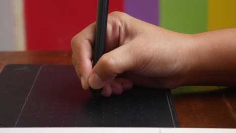 An-illustrator's-hand-using-a-pen-or-stylus-for-drawing-and-designing