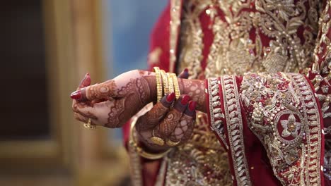 Asian-Bride-Being-Playful-With-Gold-Bangles