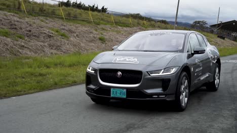 front-of-jaguar-i-pace-electric-gray-car-on-race-track