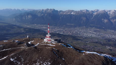 Aerial-View-Of-Patscherkofel-In-Tyrol,-South-Of-Innsbruck-In-Austria-With-Transmission-Tower-On-Mountain-Top