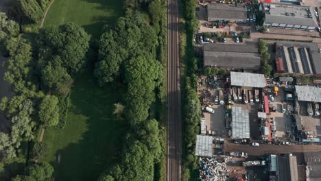 Pan-up-drone-shot-of-long-empty-National-rail-train-tracks-Cheshunt-north-London